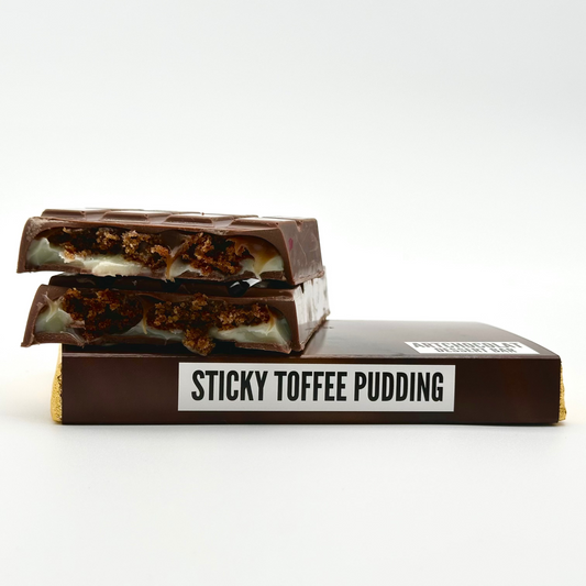 Chocolate bar labeled 'Sticky Toffee Pudding' on a white background